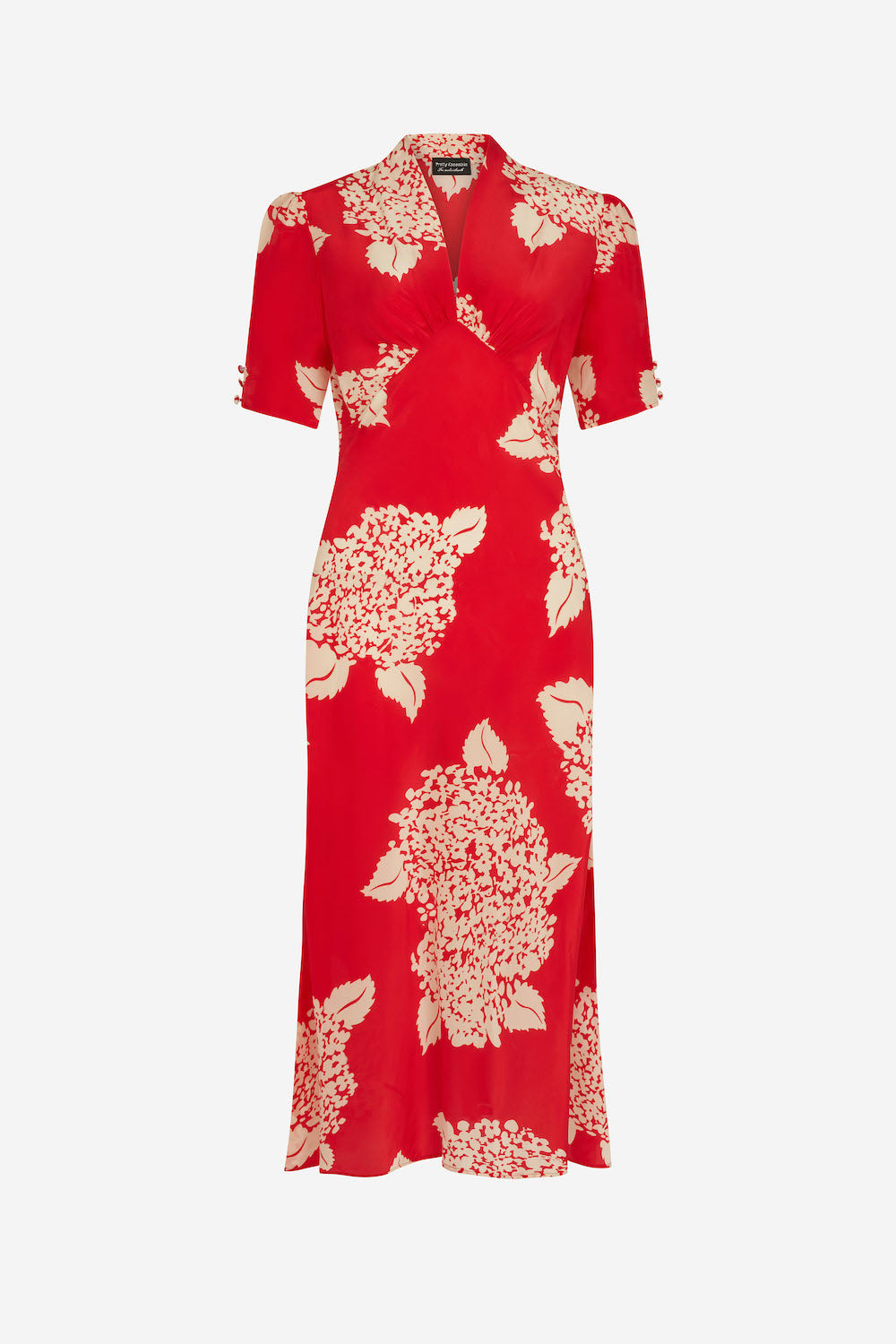 Red dress with white floral pattern on a white background