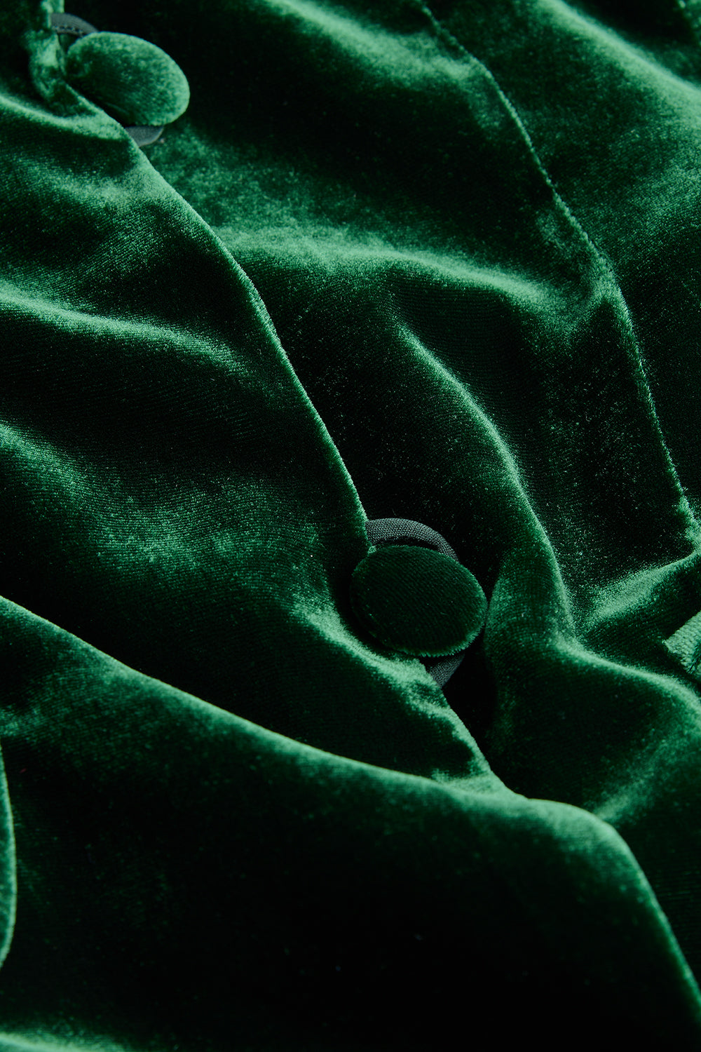 Close-up of green fabric with buttons